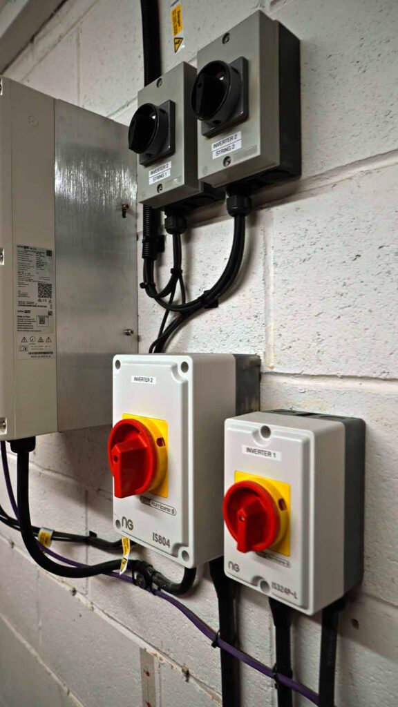 Wall-mounted inverter isolator switches and electrical units
