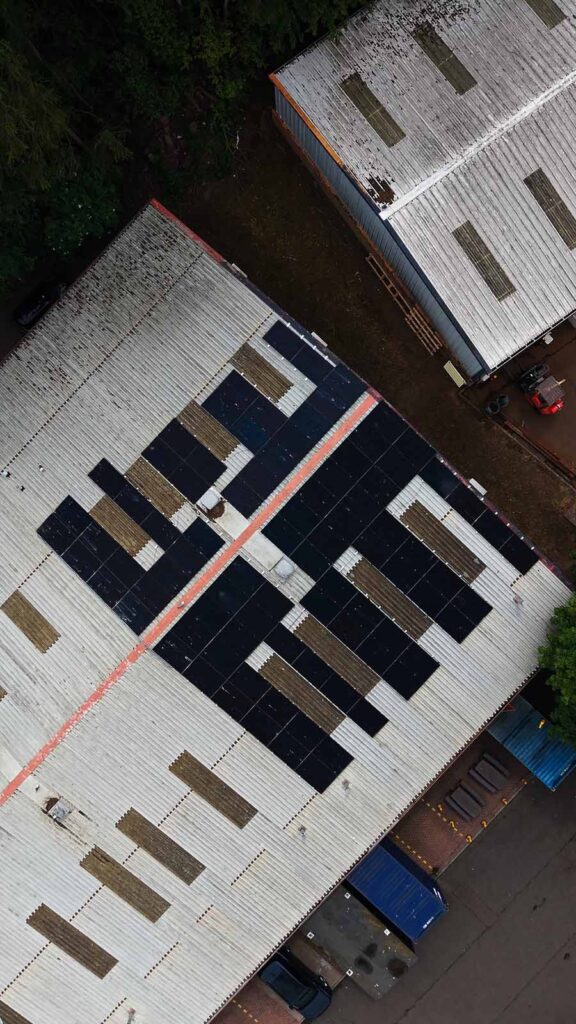 Aerial view of warehouse roof with solar panels