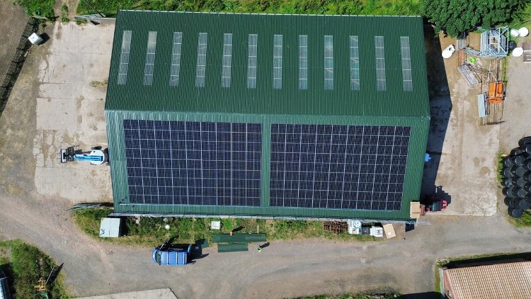 Aerial view of solar-panelled green industrial roof