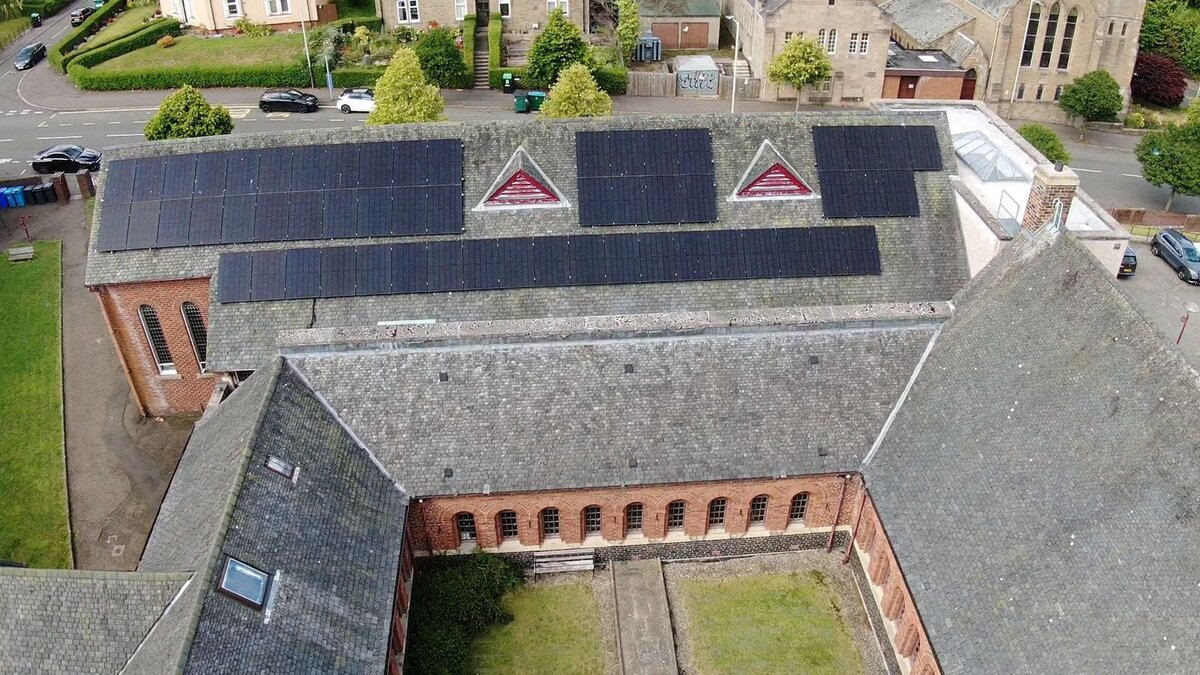 Aerial view of solar panels on church roof