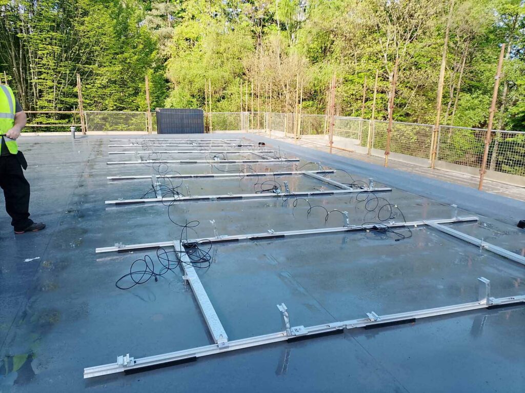 Solar panel mounting frames installed on flat rooftop